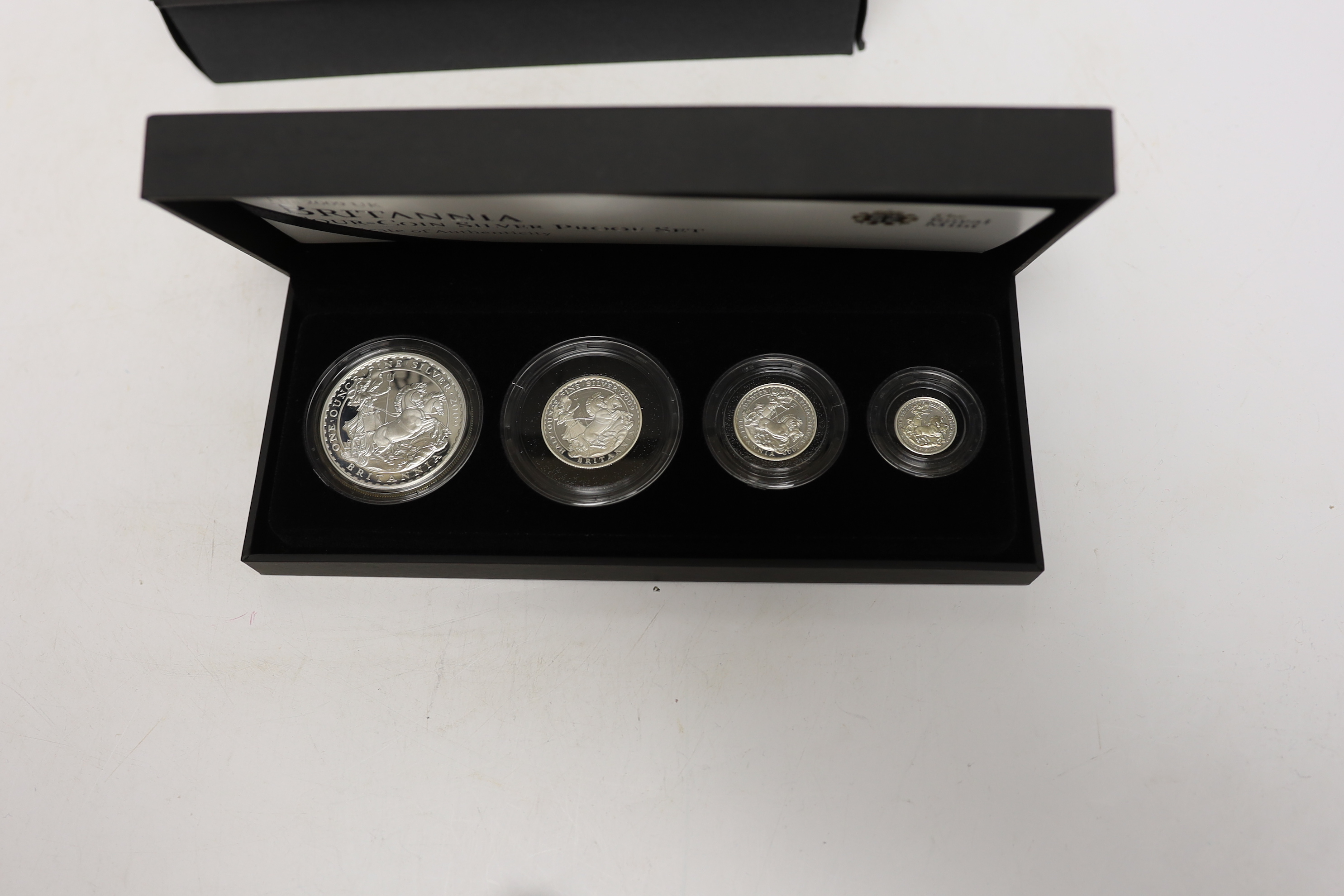 Four Royal Mint UK QEII four-coin silver proof Britannia sets for 2009 to 2012, 4 cases